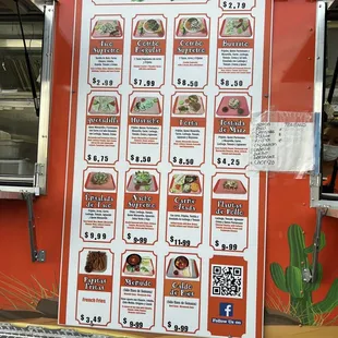 a menu on the side of a food truck