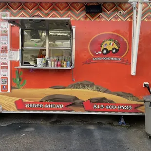 a taco truck parked in a parking lot