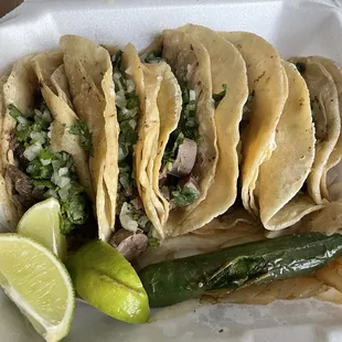 Lengua, cabeza, and asada tacos! With onion and cilantro