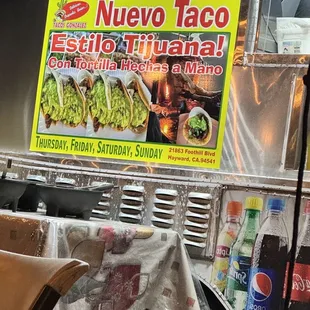 a taco truck with a menu on it