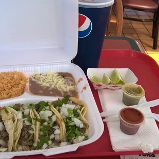 Taco meal, 4 tacos, half Asada and half cabesa with rice and beans.