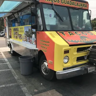 a taco truck parked in a parking lot