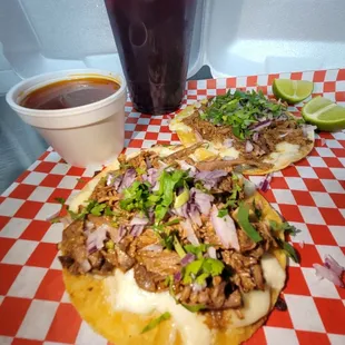 a pulled pork sandwich and a drink
