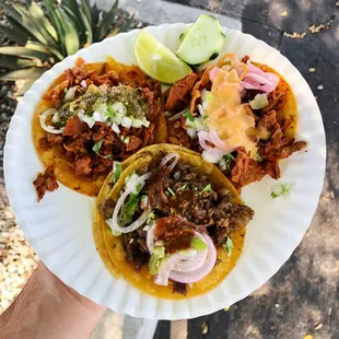 Tacos al pastor and asada with a variety of salsas