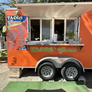 a taco truck parked in a parking lot