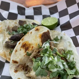 Carnitas and bistek tacos
