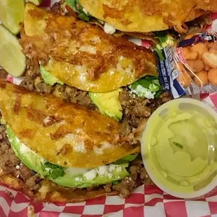 Ramirez Plate: 3 tacos of asada normal size, with cilantro, onions, avocado, queso fresco, fried cheese on the outside of the tortilla.