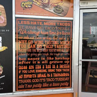 a menu on the outside of a restaurant