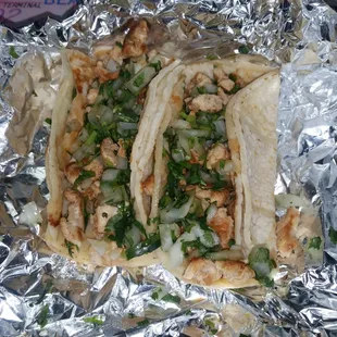 My coworker bought lunch today. 2 chicken tacos with cilantro and onions. Not bad, but overdone on the onions.