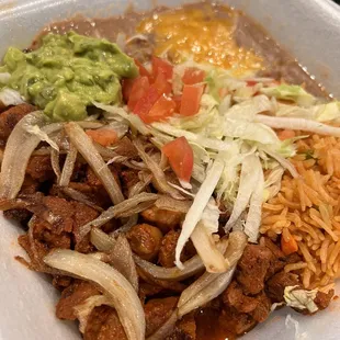 a plate of food in a styrofoam container