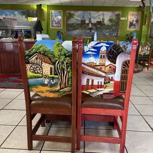 Look at the art on the chairs