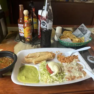 Flautas plate with beans and rice. Chips and salsa