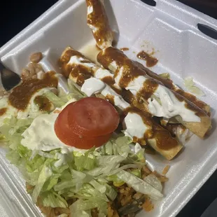 Flautas but look nothing like pictured. Didn't include silverware to eat the rice and beans