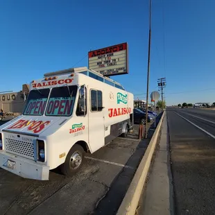 a taco truck parked on the side of the road