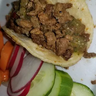 Mmmmm best in hayward . ...  asada taco minus onions and cilantro with green sauce instead