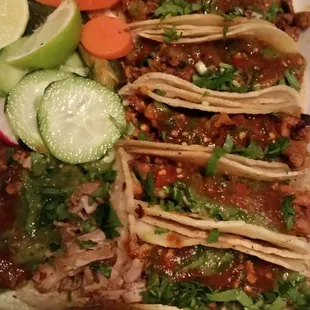 a plate of tacos and vegetables