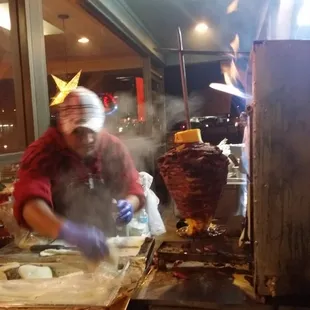 a man preparing food in a restaurant