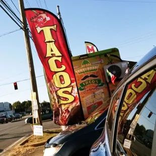 a taco truck parked on the side of the road