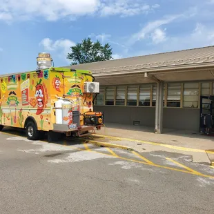 a taco truck parked in front of a building