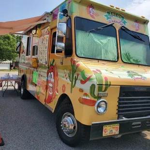 a taco truck parked in a parking lot