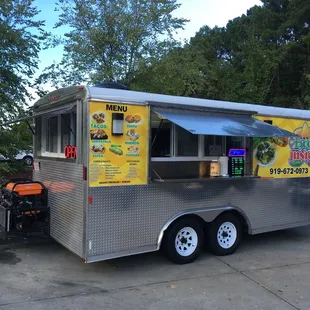 a taco truck parked in a parking lot