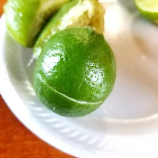 limes on a white plate