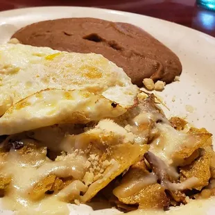 Migas with over-medium eggs and green sauce