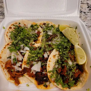 2 bistec, 2 chorizo, 2 pastor tacos. Yummmmm