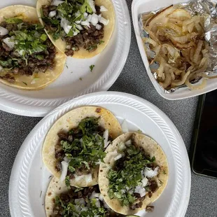 Steak Tacos on flour tortillas side of grilled onions
