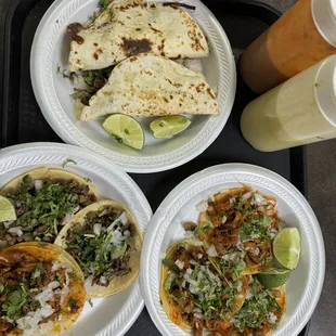 Quesadilla on top, pastor and steak tacos