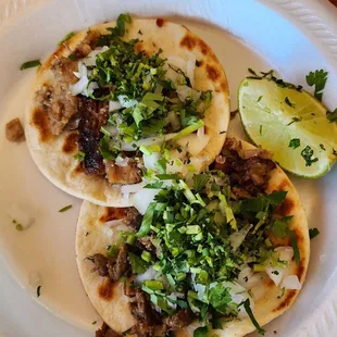 Flour tacos (1 suadero, 1 bistec)