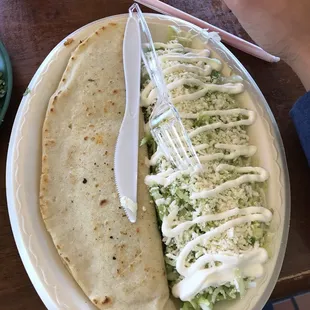 Chicken quesadilla. Served with salad (lettuce, cheese, white sauce)