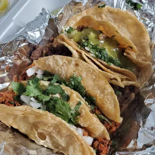 three tacoss on tin foil