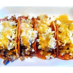 Two carne asada and two pollo tacos