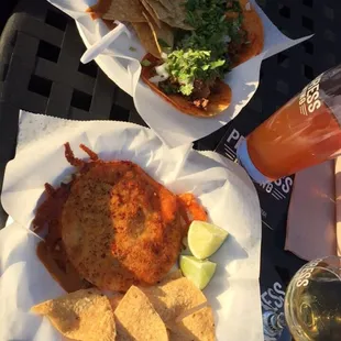 2 tacos and a bombita w/ cilantro and onion. With some lemons and chips.