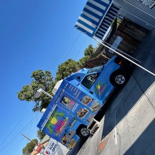 a taco truck parked on the side of the road