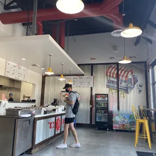 a woman standing at a counter