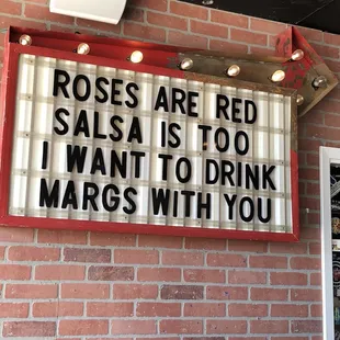 a sign that reads roses are red salsa is too i want to drink margs with you