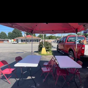 tables and chairs in a parking lot