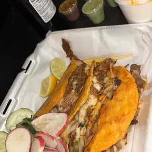 a close up of a taco in a styrofoam container