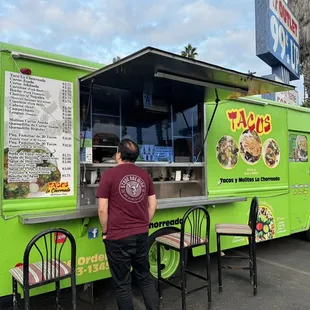 a man ordering food from a food truck