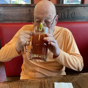 My dad beginning his long journey to the bottom of his massive Michelada. That's the way you want it.