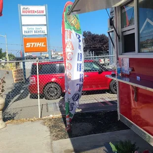a taco truck parked on the side of the road