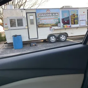a taco truck parked in a parking lot