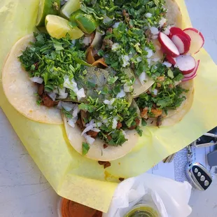 a taco on a yellow napkin