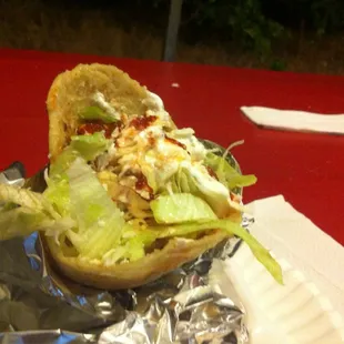 Gordita with salsa on top.