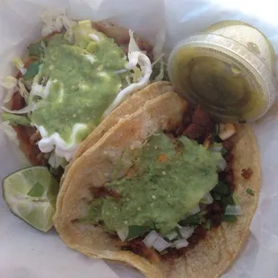 Tacos compechanas (right) and sope de carnitas (left).