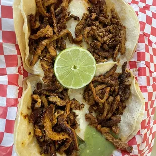 Adobada tacos with salsa verde (tacos don&apos;t come with onions or cilantro which is a plus for me!)