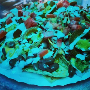 Carnitas savage nachos with sour cream. Delicious