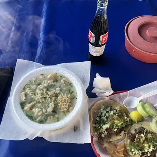 Blanco menudo and two tacos with a soda.